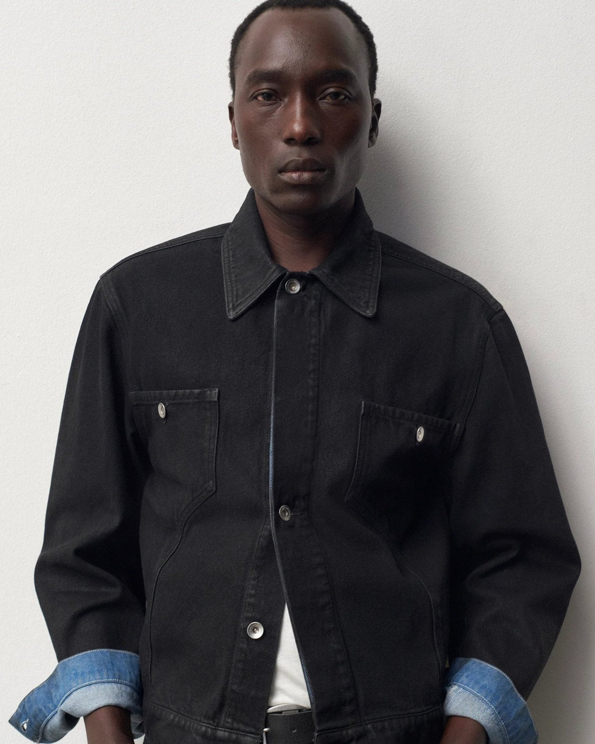 Lookbook YMC AW26, homme en chemise en denim noir